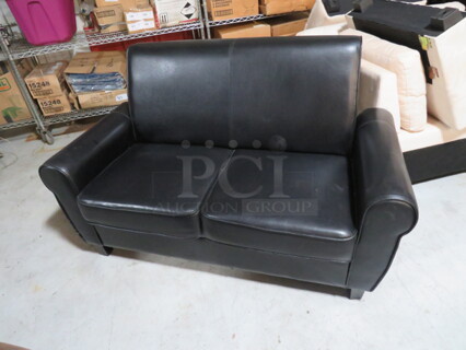One Black Pleather Couch. 60X31X35