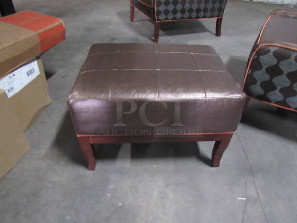 One Wooden/Cushioned Ottoman.