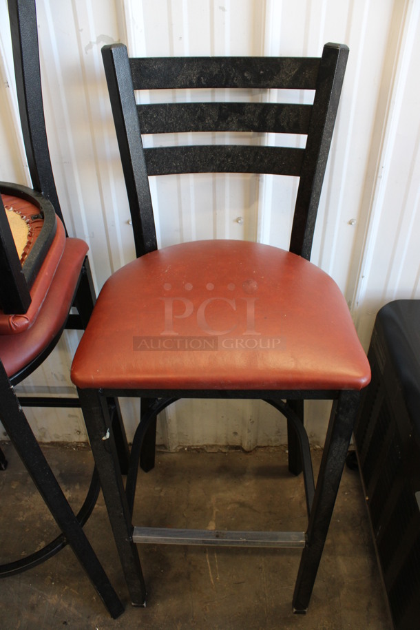 2 Black Metal Bar Height Chairs w/ Red Cushion. Stock Picture - Cosmetic Condition May Vary. 17x17x44. 2 Times Your Bid!