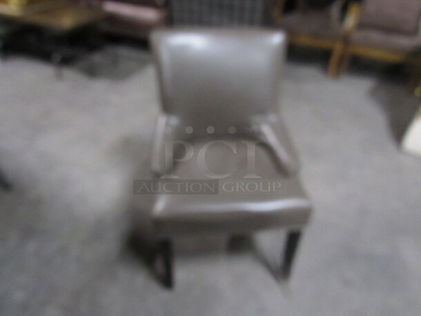 One Comfy Side/Lounge Chair With Brown Pleather Material And Nail Head Trim. 3XBID