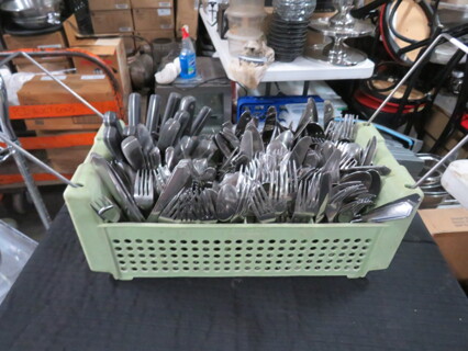 One Dishwasher Flatware Rack Full Of Assorted Flatware.