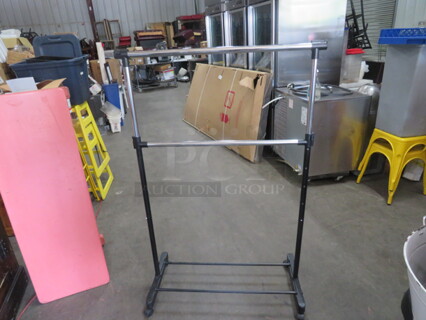 One Adjustable Garment Rack On Casters.