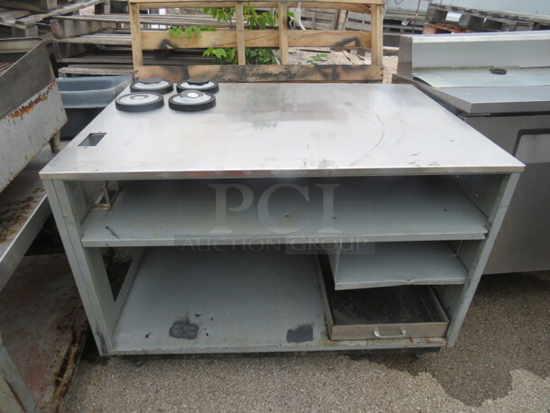 One Stainless Steel Drink Table With 2 Under Shelves, 1 Drawer, And 4 Spring Loaded Cup Dispensers. 49X34.5X34 - Image 1 of 3