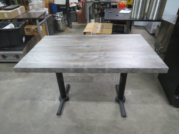 One Gray Wood Look Laminate Table Top On A Dual Pedestal Base. 48X30X30