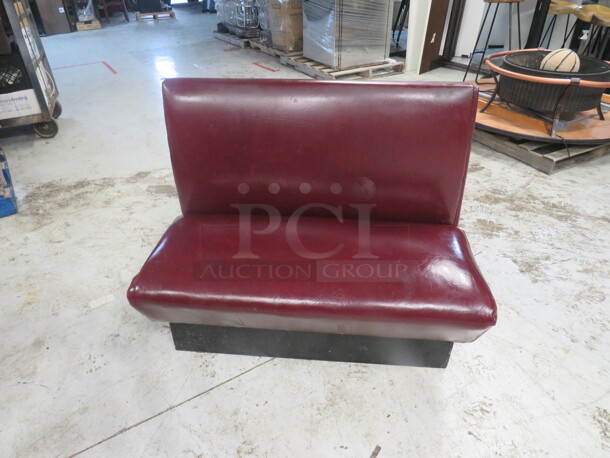 One Burgundy Single Sided Cushioned Booth. 44X24X36