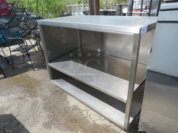 One Stainless Steel Table/Counter/Cabinet Wit 2 SS Undershelves. Enclosed On 2 Sides. 58X30X44.5
