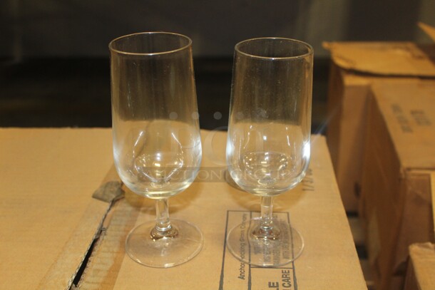 NEW IN BOX! 2 Boxes (36 Count Each). 1 Box 10oz. Anchor Hocking Excellency Pilsner Glasses And 1 box 12oz Anchor Hocking Excellency Pilsner Glasses. 72X Your Bid! 