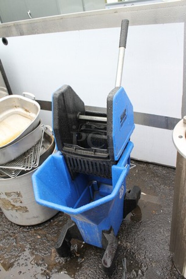 Blue Poly Mop Bucket w/ Wringing Attachment on Commercial Casters. 