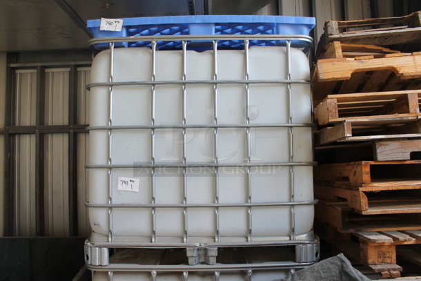 White Poly Tank in Metal Cage. BUYER MUST REMOVE. - Image 1 of 4