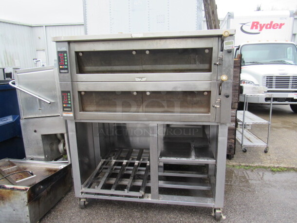 One Hobart Double Deck Oven With Under Storage On Casters. Model# HWD03D. 208 Volt. 3 Phase. 60X53X70