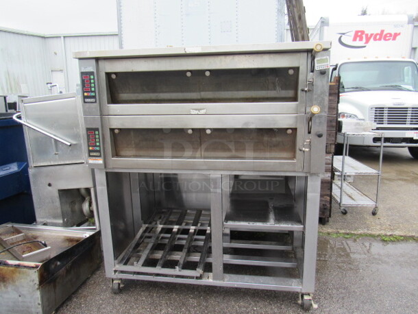 One Hobart Double Deck Oven With Under Storage On Casters. Model# HWD03D. 208 Volt. 3 Phase. 60X53X70 - Image 1 of 4
