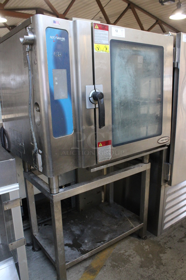 2013 Alto Shaam Model 10.10 ESI Stainless Steel Commercial Electric Powered Combitherm Convection Oven w/ View Through Door and Metal Oven Racks on Stainless Steel Equipment Stand. 208-240 Volts, 3 Phase. 46x34x67.5