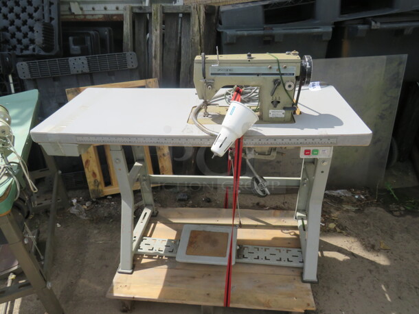One Zoje Sewing Machine on A Table. #ISM-15. 48X20X41 - Image 1 of 1
