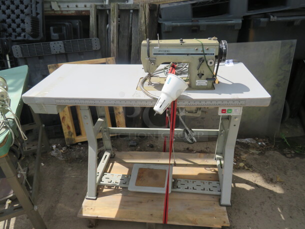 One Zoje Sewing Machine on A Table. #ISM-15. 48X20X41 - Item #1112434