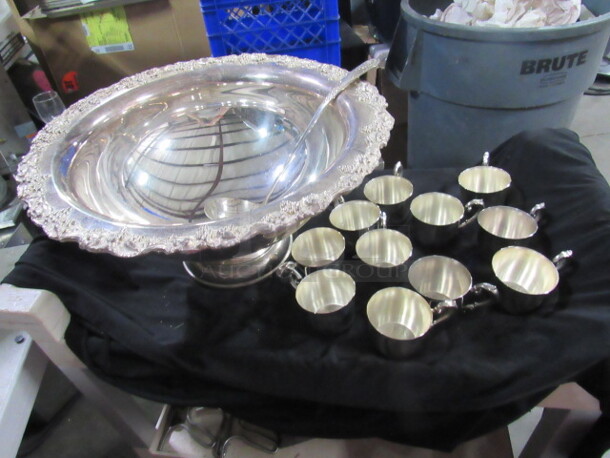 One Silver Punch Bowl, Spoon, And 11 Cups By Sheridon.