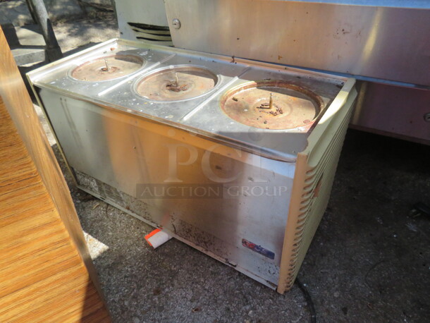 One Crathco Triple Head Refrigerated Drink Machine. Model# D35-4. 115 Volt. 25X11X14