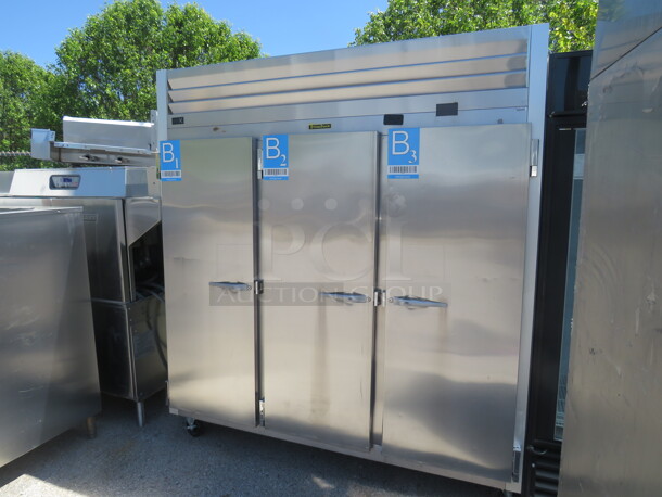 One 3 Door Stainless Steel Traulsen Refrigerator With 9 Racks On Casters. 115 Volt. Model# G30011. 76X35X83. $9727.00.  - Image 2 of 3
