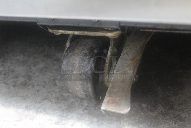 2015 True TG1R-1S ENERGY STAR Stainless Steel Commercial Single Door Reach In Cooler w/ Poly Coated Racks on Commercial Casters. 115 Volts, 1 Phase. Tested and Working! - Image 5 of 6