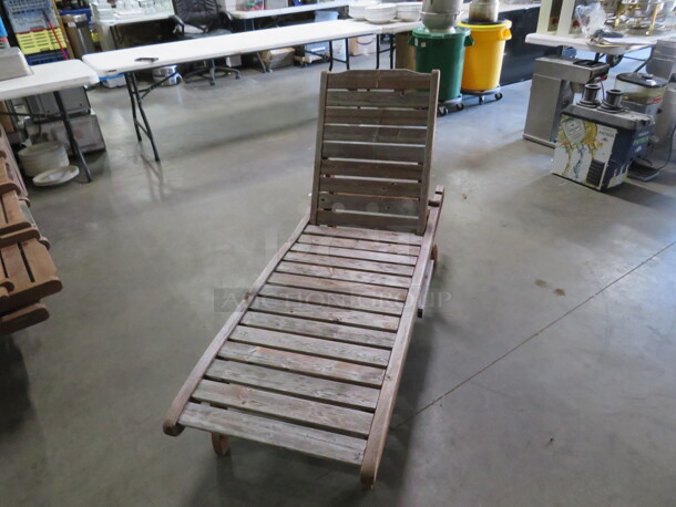 One Adjustable Wooden Chaise Lounger With 2 Wheels, And A Pullout Shelf. Needs A Lil Adjusting. 72X23 - Image 1 of 3