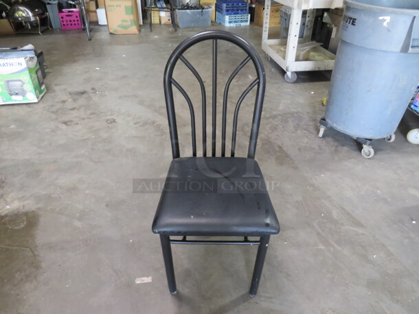 Black Metal Chair With A Black Cushioned Seat. 2XBID