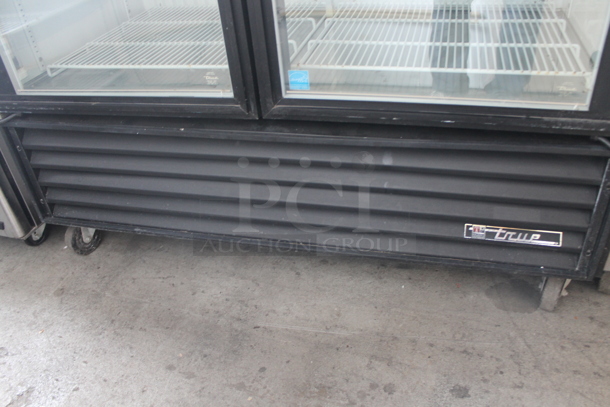 2011 True GDM-49F ENERGY STAR Metal Commercial 2 Door Reach In Freezer Merchandiser w/ Poly Coated Racks on Commercial Casters. 115/208-230 Volts, 1 Phase.  - Image 6 of 8