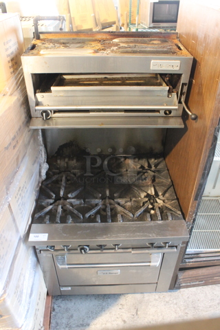 US Range Stainless Steel Commercial Natural Gas Powered 6 Burner Range w/ Salamander Cheese Melter, Oven and Back Splash. 