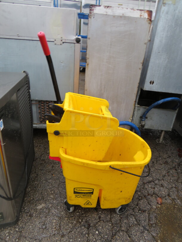 One Rubbermaid Mop Bucket And Wringer. - Image 1 of 1