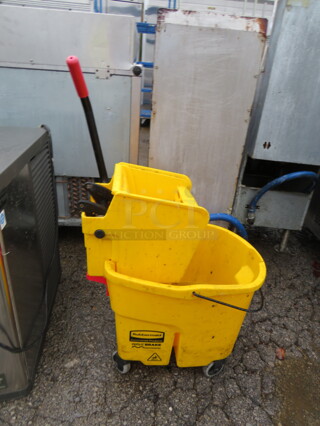 One Rubbermaid Mop Bucket And Wringer.