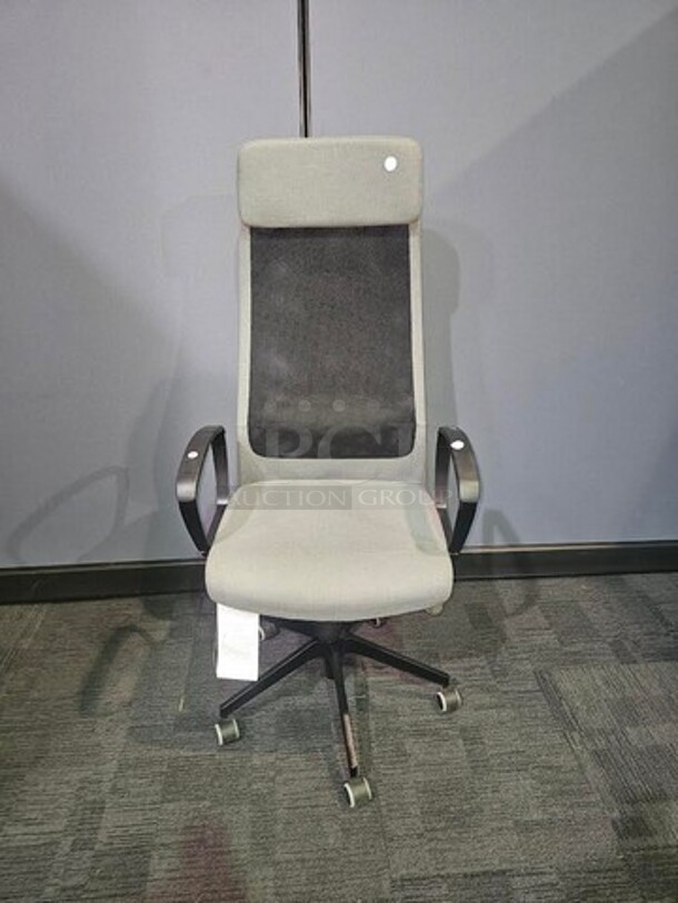 IKEA Markus adjustable office chair- grey and black in color with lumbar support and cushioned head rest. In good condition with minor signs of use, no tears or rips. No stains, nothing broken. Measures 54” H x 24.5” W. 

  - Image 1 of 3
