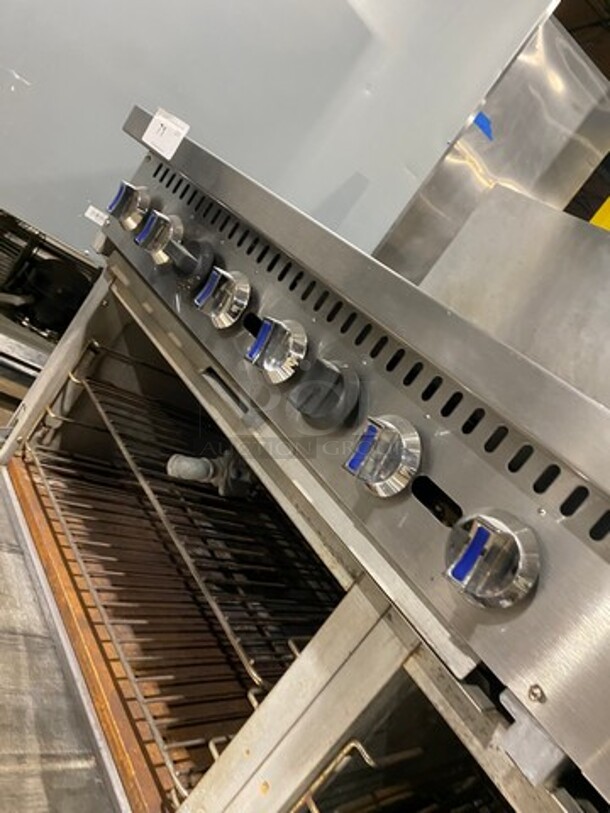 Patriot Commercial Natural Gas Powered 6 Burner Stove With Flat Griddle! Flat Griddle Has Side Splashes! With Raised Back Splash! With 2 Oven Underneath! Metal Oven Racks! All Stainless Steel! On Casters! WORKING WHEN REMOVED! - Image 10 of 12