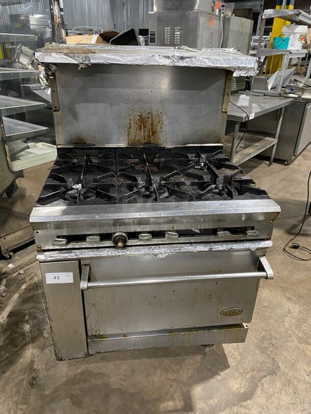 WOW! DCS Commercial Natural Gas Powered 6 Burner Stove! With Full Size Oven Underneath! With Backsplash & Overhead Salamander Shelf! All Stainless Steel! On Casters! WORKING WHEN REMOVED! - Image 1 of 9