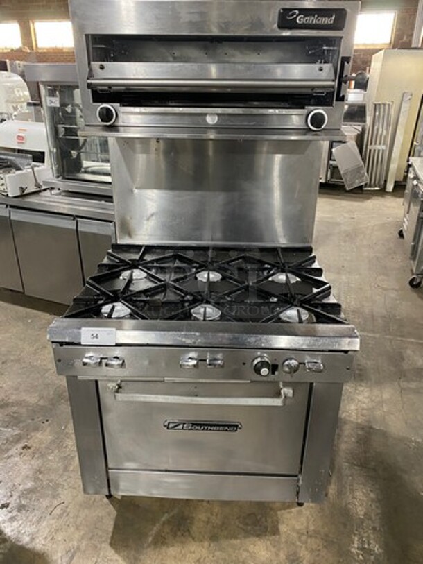 Southbend Commercial Gas Powered 6 Burner Stove! With Raised Back Splash And Garland Salamander! With Oven Underneath! All Stainless Steel! On Legs!
