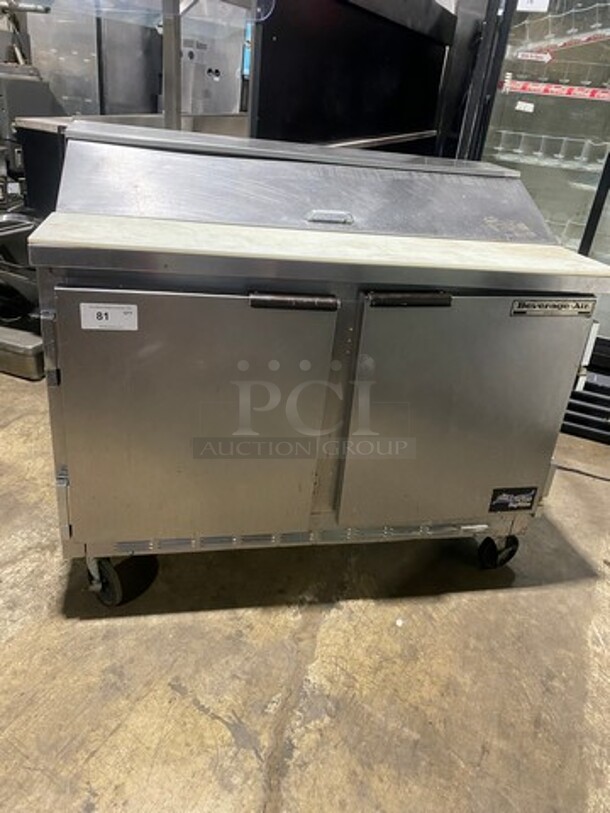 Nice! Beverage Air Commercial Refrigerated Sandwich Prep Table! With Commercial Cutting Board! With 2 Door Underneath Storage Space! With Poly Coated Racks! All Stainless Steel! On Casters! Model: SPE4812 115V 60HZ 1 Phase! Working When Removed! - Image 1 of 9