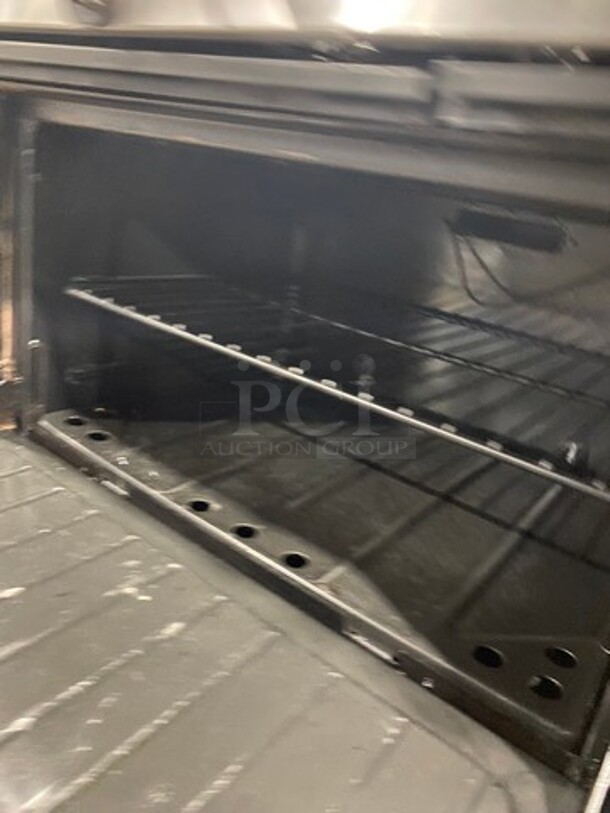 Garland Commercial Natural Gas Powered 12 Burner Stove! With 2 Full-Sized Ovens! With Metal Oven Racks! With Raised Back Splash & Salamander Shelf! Stainless Steel! On Casters! Working When Removed! - Image 8 of 10
