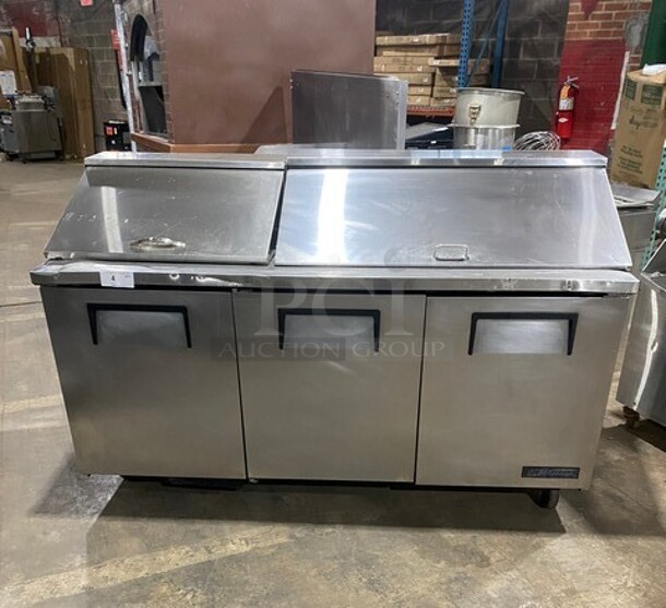 True Commercial Refrigerated Mega Top Sandwich Prep Table! With 3 Door Storage Space Underneath! Poly Coated Racks! All Stainless Steel! On Casters! Model: TSSU7218 SN: 14477571! 115V 60HZ 1 Phase!