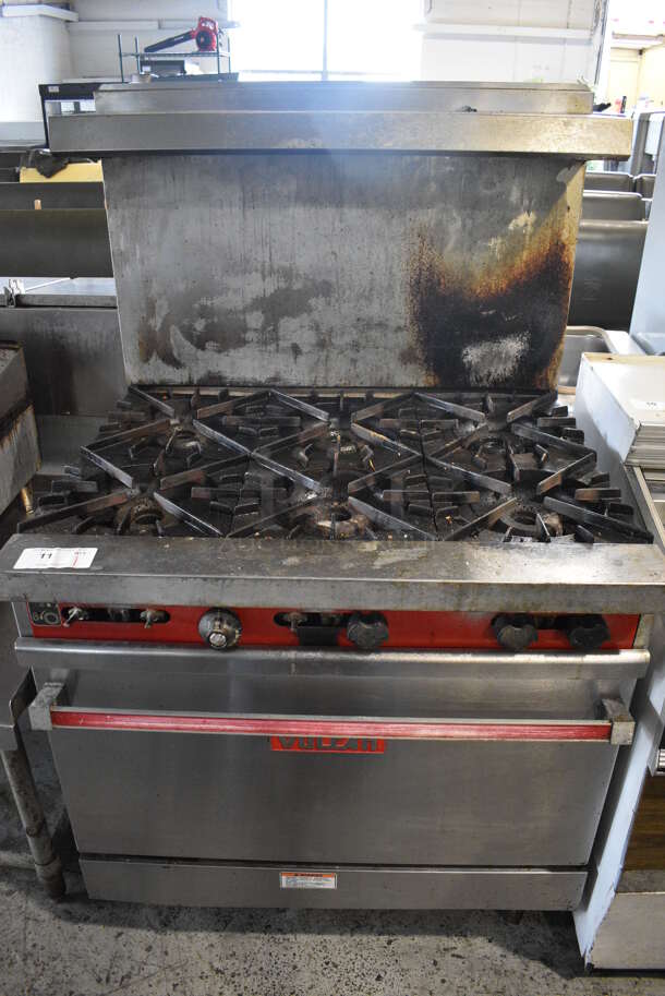 Vulcan Stainless Steel Commercial Gas Powered 6 Burner Range w/ Oven, Over Shelf and Back Splash on Commercial Casters. 36x30.5x59