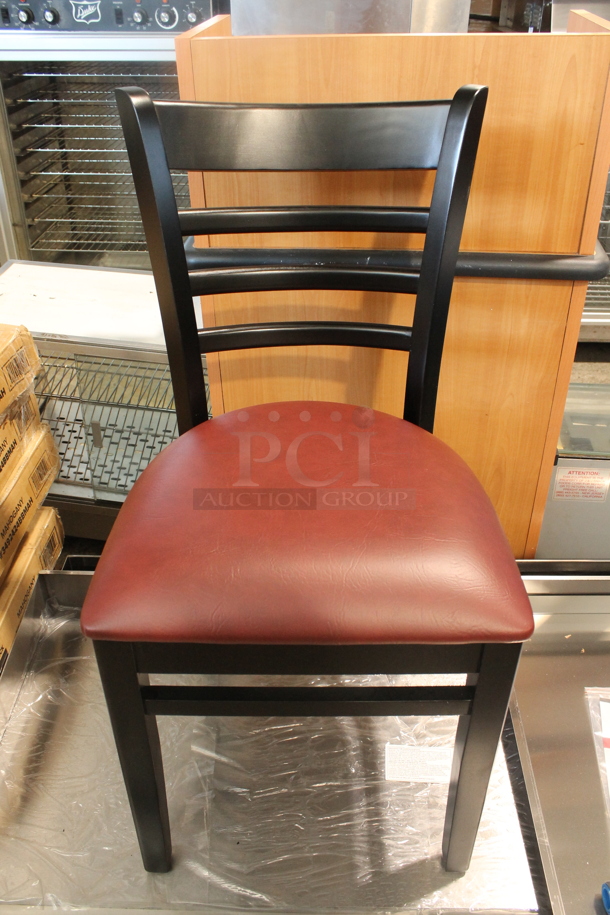 4 BRAND NEW SCRATCH AND DENT! Lancaster Table & Seating 164CLADBLKFR Black Ladder Back Dining Chairs w/ Burgundy Vinyl Seat Cushions. 4 Times Your Bid! - Image 1 of 4