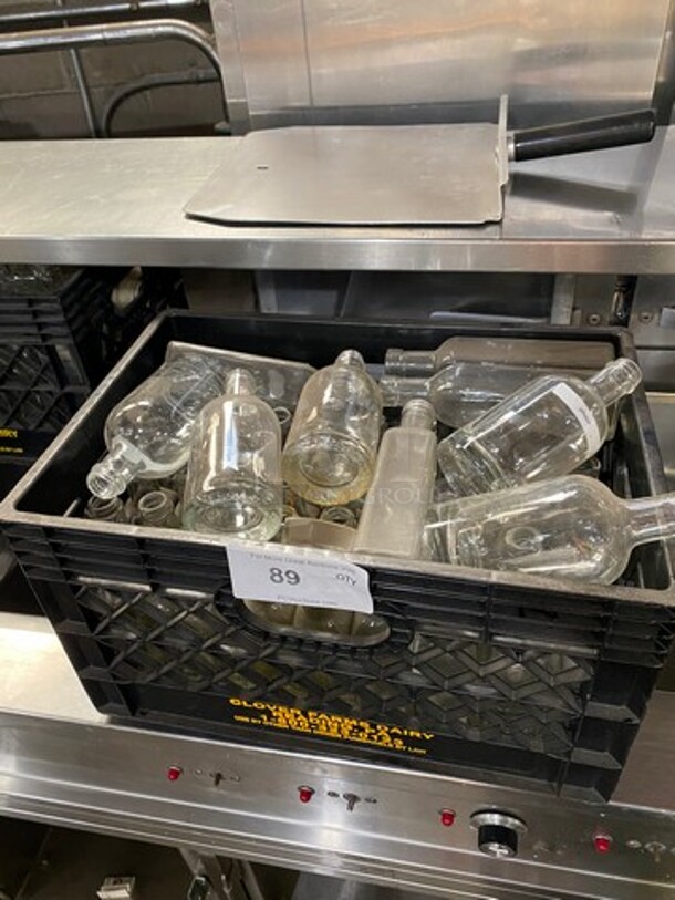 ALL ONE MONEY! Assorted Style And Size Clear Glass Bottles! For Multipurpose Use! Includes Black Poly Crate! - Image 1 of 4