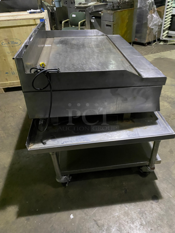 MUST HAVE! Garland Commercial Countertop Natural Gas Powered Heavy Duty Plancha Flat Grill! With Back And Side Splashes! On Heavy-Duty Stainless-Steel Equipment Stand! With Underneath Storage Space! On Casters! - Image 3 of 9