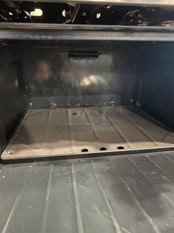 US Range Commercial Natural Gas Powered 4 Burner Stove! With Right Side Flat Griddle! With Backsplash & Overhead Salamander Shelf! With Full Size Oven Underneath! All Stainless Steel!  - Image 8 of 10