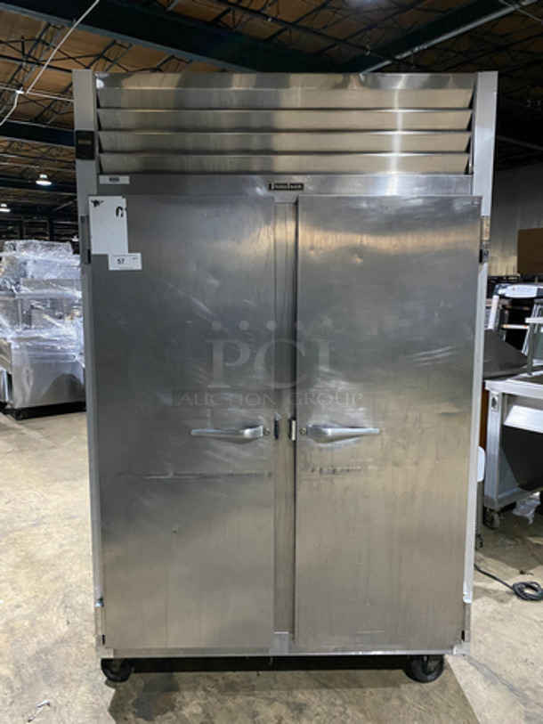COOL! Traulsen 2 Door Reach In Freezer Unit! With Poly Coated Racks! All Stainless Steel! On Casters! Model: G22010 SN: TT50688J13 115V 60HZ 1 Phase! Works Great! 