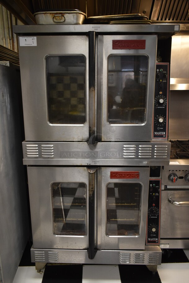 2 Garland Master 200 Stainless Steel Commercial Full Size Convection Ovens w/ View Through Doors, Metal Oven Racks and Thermostatic Controls. 2 Times Your Bid! BUYER MUST REMOVE. Tested and Working! (kitchen)
