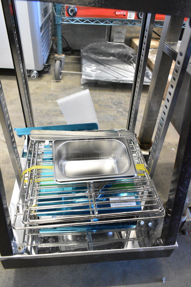 BRAND NEW SCRATCH AND DENT! 2024 Avantco 177HDC13 3" Self/Full Service 3 Shelf Countertop Heated Display Case with Hinged Doors. 120 Volts, 1 Phase. Tested and Working! - Image 4 of 5