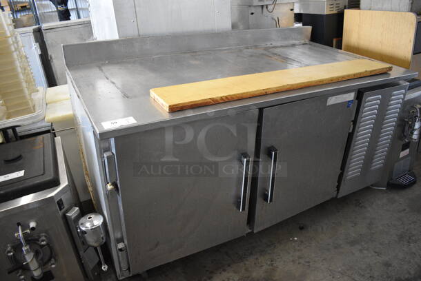 Migali Stainless Steel Commercial 2 Door Work Top Cooler. 115 Volts, 1 Phase. 64x34x40. Tested and Powers On But Does Not Get Cold.