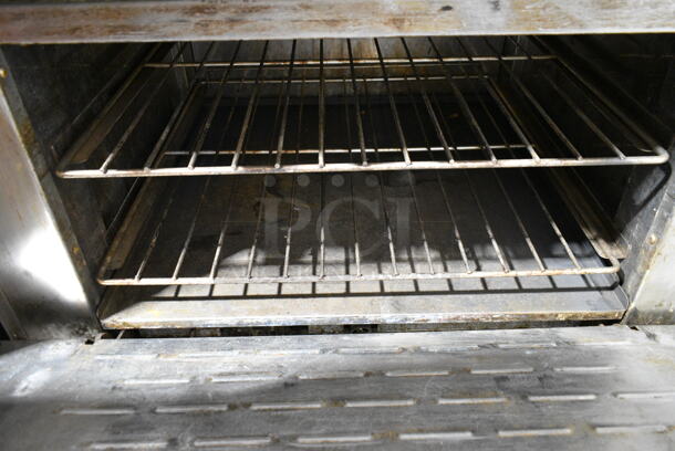 Radiance Stainless Steel Commercial Natural Gas Powered 6 Burner Range w/ Oven, Over Shelf and Back Splash on Commercial Casters. 2 Casters Need To Be Reattached. - Image 3 of 5