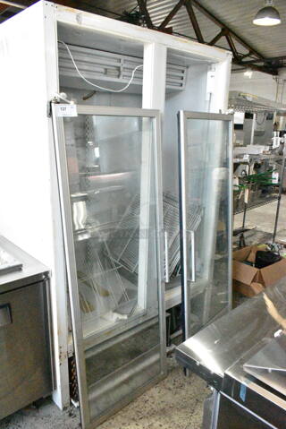 Frigidaire ULG50BD-4 Metal Commercial 2 Door Reach In Freezer Merchandiser. Doors Need To Be Reattached. 115/208-230 Volts, 1 Phase. 
