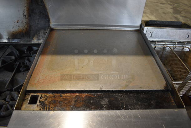 Garland SunFire Stainless Steel Commercial Natural Gas Powered 6 Burner Range w/ Flat Top Griddle, 2 Ovens, Over Shelf and Back Splash on Commercial Casters. 60x33x60 - Image 4 of 11