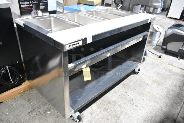 BRAND NEW! 2023 Delfield EHEI60C Stainless Steel Commercial Floor Style Electric Powered 4 Bay Steam Table w/ Under Shelf on Commercial Casters. 208-230 Volts, 1 Phase. - Image 2 of 9