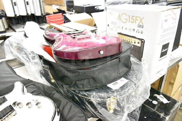 4 Items Including Schecter R022110323 Diamond Series 6 String Guitar, Marshall MG15FX Guitar Amp, Winzz 6 String Guitar in Soft Guitar Case, Guitar in TKL 0996475000 Case. 4 Times Your Bid!  - Image 1 of 12