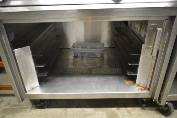 Jade Range JTRH-2-24IP Commercial Stainless Steel Heavy Duty Natural Gas Powered Range With Fry Top, Hot Top, Broiler, 2 Overshelves, And Box Of Additional Parts On Commercial Casters. - Image 8 of 8